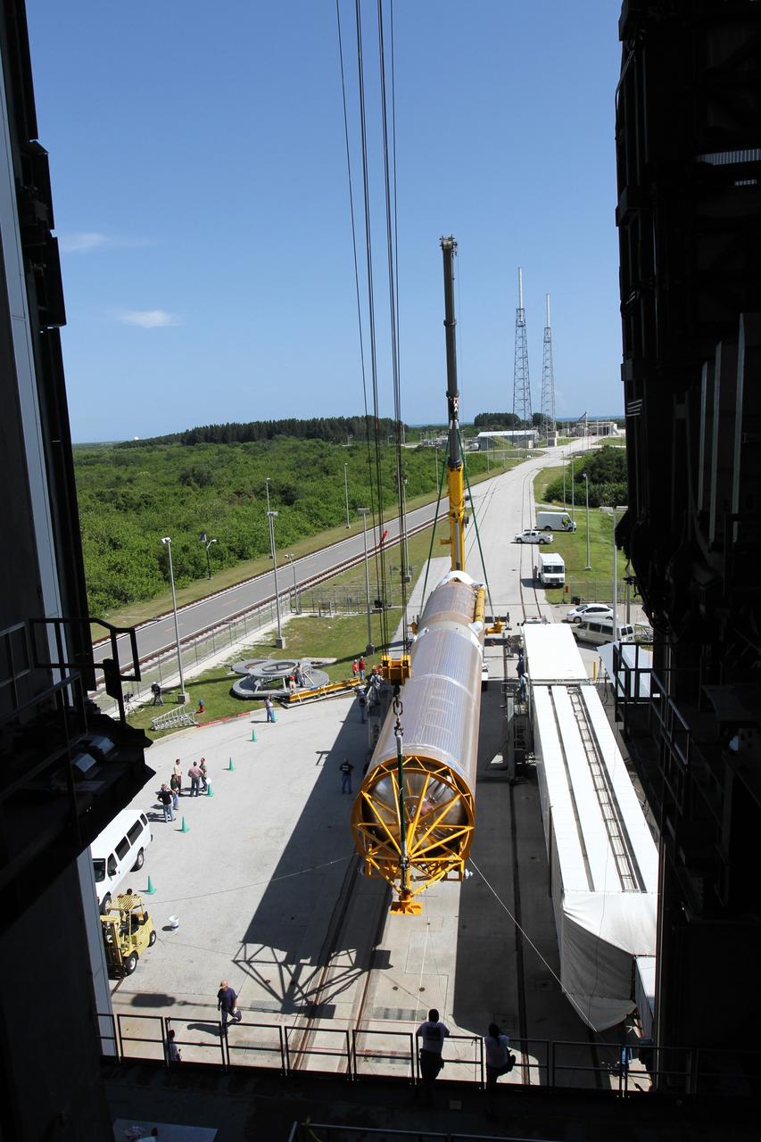 CAPE CANAVERAL, Fla. - At Launch Complex 41 at Cape Canaveral Air Force Station in Florida, a large crane begins to lift the first stage of the United Launch Alliance Atlas V rocket into the vertical position. The Atlas V is being prepared for the Radiation Belt Storm Probes, or RBSP, mission. NASA’s RBSP mission will help us understand the sun’s influence on Earth and near-Earth space by studying the Earth’s radiation belts on various scales of space and time. RBSP will begin its mission of exploration of Earth’s Van Allen radiation belts and the extremes of space weather after its launch aboard an Atlas V rocket. Launch is targeted for Aug. 23. For more information, visit http://www.nasa.gov/rbsp. Photo credit: NASA/Cory Huston