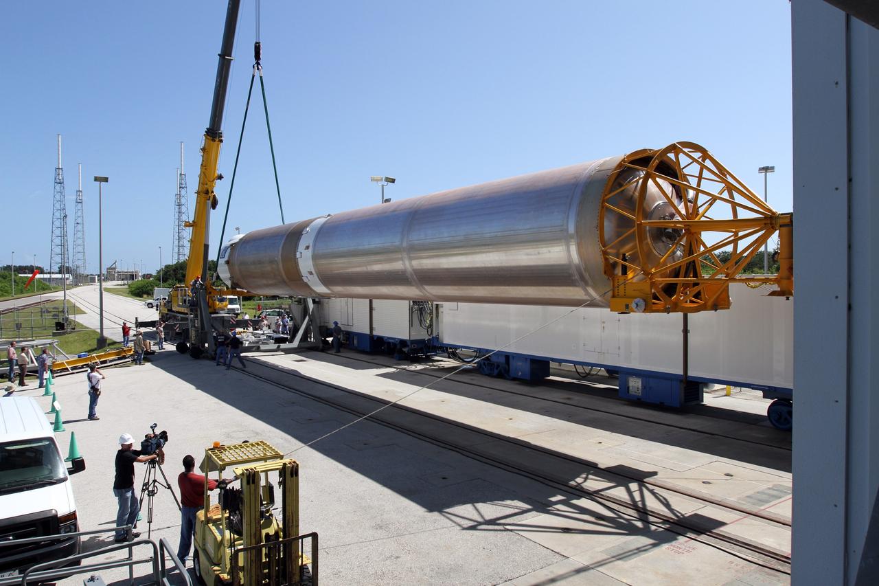 CAPE CANAVERAL, Fla. - At Launch Complex 41 at Cape Canaveral Air Force Station in Florida, technicians monitor the progress as a large crane begins to lift the first stage of the United Launch Alliance Atlas V rocket into the vertical position. The Atlas V is being prepared for the Radiation Belt Storm Probes, or RBSP, mission.    NASA’s RBSP mission will help us understand the sun’s influence on Earth and near-Earth space by studying the Earth’s radiation belts on various scales of space and time. RBSP will begin its mission of exploration of Earth’s Van Allen radiation belts and the extremes of space weather after its launch aboard an Atlas V rocket. Launch is targeted for Aug. 23. For more information, visit http://www.nasa.gov/rbsp. Photo credit: NASA/Cory Huston