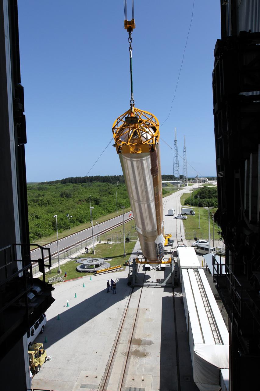CAPE CANAVERAL, Fla. - At Launch Complex 41 at Cape Canaveral Air Force Station in Florida, a large crane lifts the first stage of the United Launch Alliance Atlas V rocket into the vertical position. The Atlas V is being prepared for the Radiation Belt Storm Probes, or RBSP, mission. NASA’s RBSP mission will help us understand the sun’s influence on Earth and near-Earth space by studying the Earth’s radiation belts on various scales of space and time. RBSP will begin its mission of exploration of Earth’s Van Allen radiation belts and the extremes of space weather after its launch aboard an Atlas V rocket. Launch is targeted for Aug. 23. For more information, visit http://www.nasa.gov/rbsp. Photo credit: NASA/Cory Huston