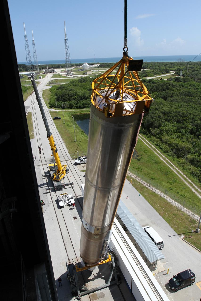 CAPE CANAVERAL, Fla. - At Launch Complex 41 at Cape Canaveral Air Force Station in Florida, a large crane lifts the first stage of the United Launch Alliance Atlas V rocket into the vertical position. The Atlas V is being prepared for the Radiation Belt Storm Probes, or RBSP, mission. NASA’s RBSP mission will help us understand the sun’s influence on Earth and near-Earth space by studying the Earth’s radiation belts on various scales of space and time. RBSP will begin its mission of exploration of Earth’s Van Allen radiation belts and the extremes of space weather after its launch aboard an Atlas V rocket. Launch is targeted for Aug. 23. For more information, visit http://www.nasa.gov/rbsp. Photo credit: NASA/Cory Huston