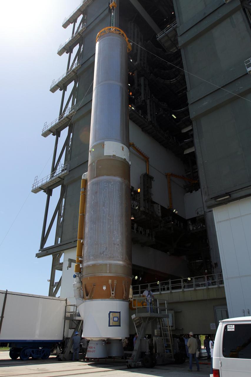CAPE CANAVERAL, Fla. - At Launch Complex 41 at Cape Canaveral Air Force Station in Florida, a large crane lifts the first stage of the United Launch Alliance Atlas V rocket into the vertical position. The Atlas V is being prepared for the Radiation Belt Storm Probes, or RBSP, mission.    NASA’s RBSP mission will help us understand the sun’s influence on Earth and near-Earth space by studying the Earth’s radiation belts on various scales of space and time. RBSP will begin its mission of exploration of Earth’s Van Allen radiation belts and the extremes of space weather after its launch aboard an Atlas V rocket. Launch is targeted for Aug. 23. For more information, visit http://www.nasa.gov/rbsp. Photo credit: NASA/Cory Huston