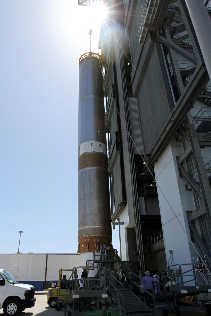 CAPE CANAVERAL, Fla. - At Launch Complex 41 at Cape Canaveral Air Force Station in Florida, a large crane lifts the first stage of the United Launch Alliance Atlas V rocket into the vertical position. The Atlas V is being prepared for the Radiation Belt Storm Probes, or RBSP, mission. NASA’s RBSP mission will help us understand the sun’s influence on Earth and near-Earth space by studying the Earth’s radiation belts on various scales of space and time. RBSP will begin its mission of exploration of Earth’s Van Allen radiation belts and the extremes of space weather after its launch aboard an Atlas V rocket. Launch is targeted for Aug. 23. For more information, visit http://www.nasa.gov/rbsp. Photo credit: NASA/Cory Huston