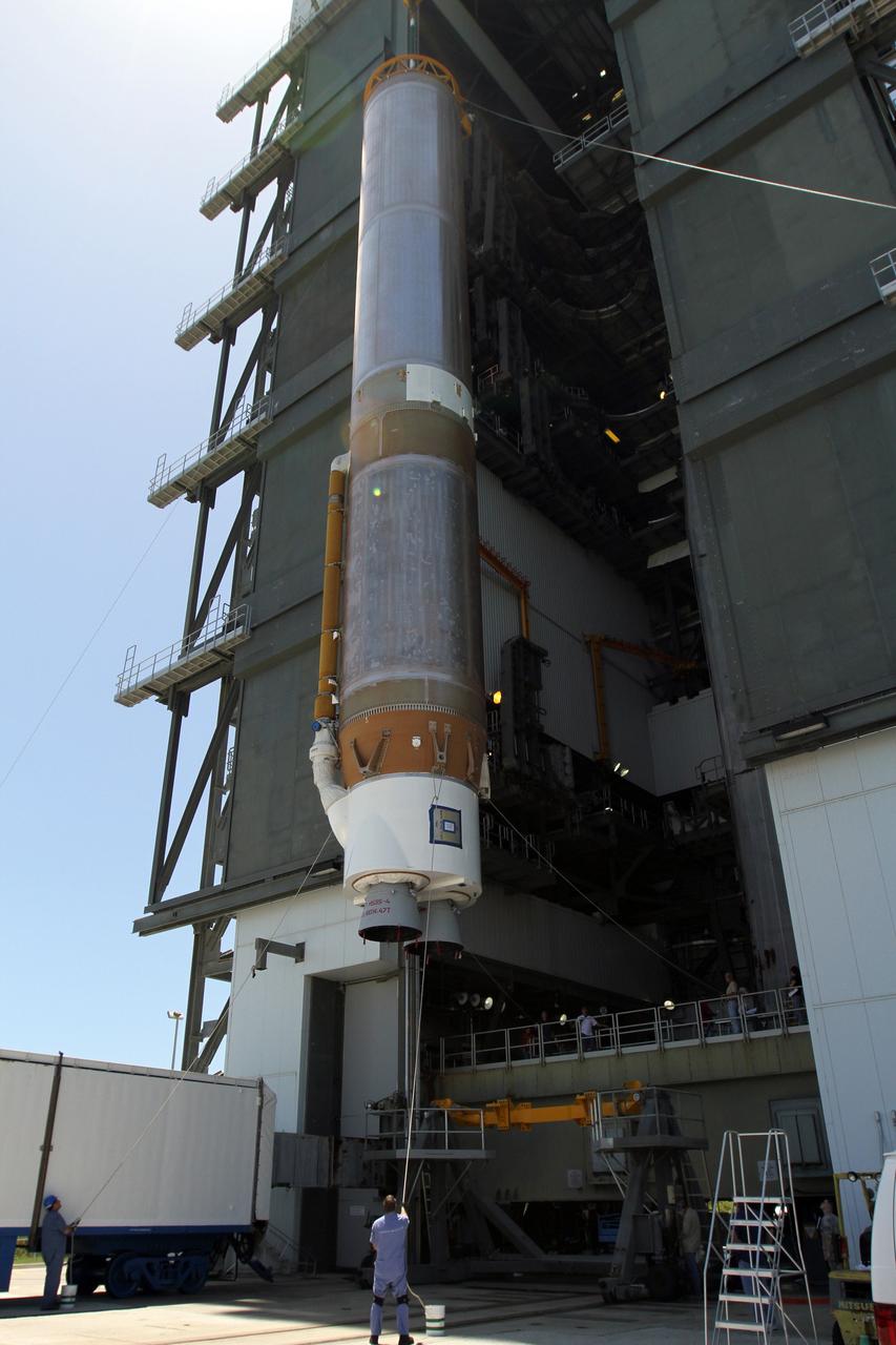 CAPE CANAVERAL, Fla. - At Launch Complex 41 at Cape Canaveral Air Force Station in Florida, a large crane lifts the first stage of the United Launch Alliance Atlas V rocket into the vertical position. The Atlas V is being prepared for the Radiation Belt Storm Probes, or RBSP, mission. NASA’s RBSP mission will help us understand the sun’s influence on Earth and near-Earth space by studying the Earth’s radiation belts on various scales of space and time. RBSP will begin its mission of exploration of Earth’s Van Allen radiation belts and the extremes of space weather after its launch aboard an Atlas V rocket. Launch is targeted for Aug. 23. For more information, visit http://www.nasa.gov/rbsp. Photo credit: NASA/Cory Huston