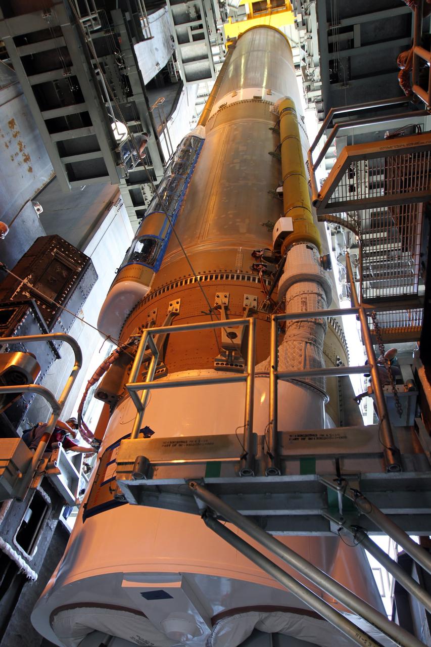 CAPE CANAVERAL, Fla. - At Launch Complex 41 at Cape Canaveral Air Force Station in Florida, the first stage of the United Launch Alliance Atlas V rocket is moved into the Vertical Integration Facility. The Atlas V is being prepared for the Radiation Belt Storm Probes, or RBSP, mission.    NASA’s RBSP mission will help us understand the sun’s influence on Earth and near-Earth space by studying the Earth’s radiation belts on various scales of space and time. RBSP will begin its mission of exploration of Earth’s Van Allen radiation belts and the extremes of space weather after its launch aboard an Atlas V rocket. Launch is targeted for Aug. 23. For more information, visit http://www.nasa.gov/rbsp. Photo credit: NASA/Cory Huston