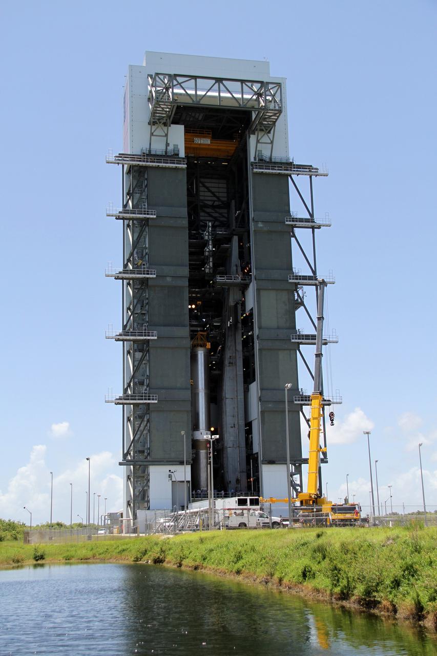 CAPE CANAVERAL, Fla. - At Launch Complex 41 at Cape Canaveral Air Force Station in Florida, the first stage of the United Launch Alliance Atlas V rocket is in the Vertical Integration Facility. The Atlas V is being prepared for the Radiation Belt Storm Probes, or RBSP, mission.    NASA’s RBSP mission will help us understand the sun’s influence on Earth and near-Earth space by studying the Earth’s radiation belts on various scales of space and time. RBSP will begin its mission of exploration of Earth’s Van Allen radiation belts and the extremes of space weather after its launch aboard an Atlas V rocket. Launch is targeted for Aug. 23. For more information, visit http://www.nasa.gov/rbsp. Photo credit: NASA/Cory Huston