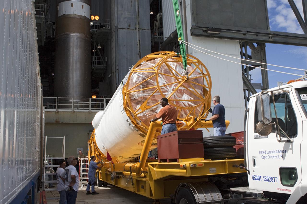 CAPE CANAVERAL, Fla. – At Space Launch Complex 41 at Cape Canaveral Air Force Station, Fla., United Launch Alliance technicians begin to lift the Centaur stage for mating with the Atlas V rocket, which will launch the Radiation Belt Storm Probes, or RBSP, spacecraft. NASA’s RBSP mission will help us understand the sun’s influence on Earth and near-Earth space by studying the Earth’s radiation belts on various scales of space and time. RBSP will begin its mission of exploration of Earth’s Van Allen radiation belts and the extremes of space weather after its liftoff aboard a United Launch Alliance Atlas V from Cape Canaveral. Liftoff is targeted for Aug. 23, 2012. For more information, visit http://www.nasa.gov/rbsp. Photo credit: NASA/Jim Grossmann
