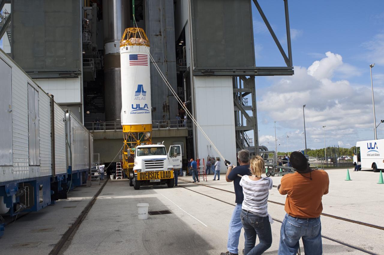 CAPE CANAVERAL, Fla. – At Space Launch Complex 41 at Cape Canaveral Air Force Station, Fla., United Launch Alliance technicians support the lifting operation as the Centaur stage is prepared for mating with the Atlas V rocket, which will launch the Radiation Belt Storm Probes, or RBSP, spacecraft. NASA’s RBSP mission will help us understand the sun’s influence on Earth and near-Earth space by studying the Earth’s radiation belts on various scales of space and time. RBSP will begin its mission of exploration of Earth’s Van Allen radiation belts and the extremes of space weather after its liftoff aboard a United Launch Alliance Atlas V from Cape Canaveral. Liftoff is targeted for Aug. 23, 2012. For more information, visit http://www.nasa.gov/rbsp. Photo credit: NASA/Jim Grossmann