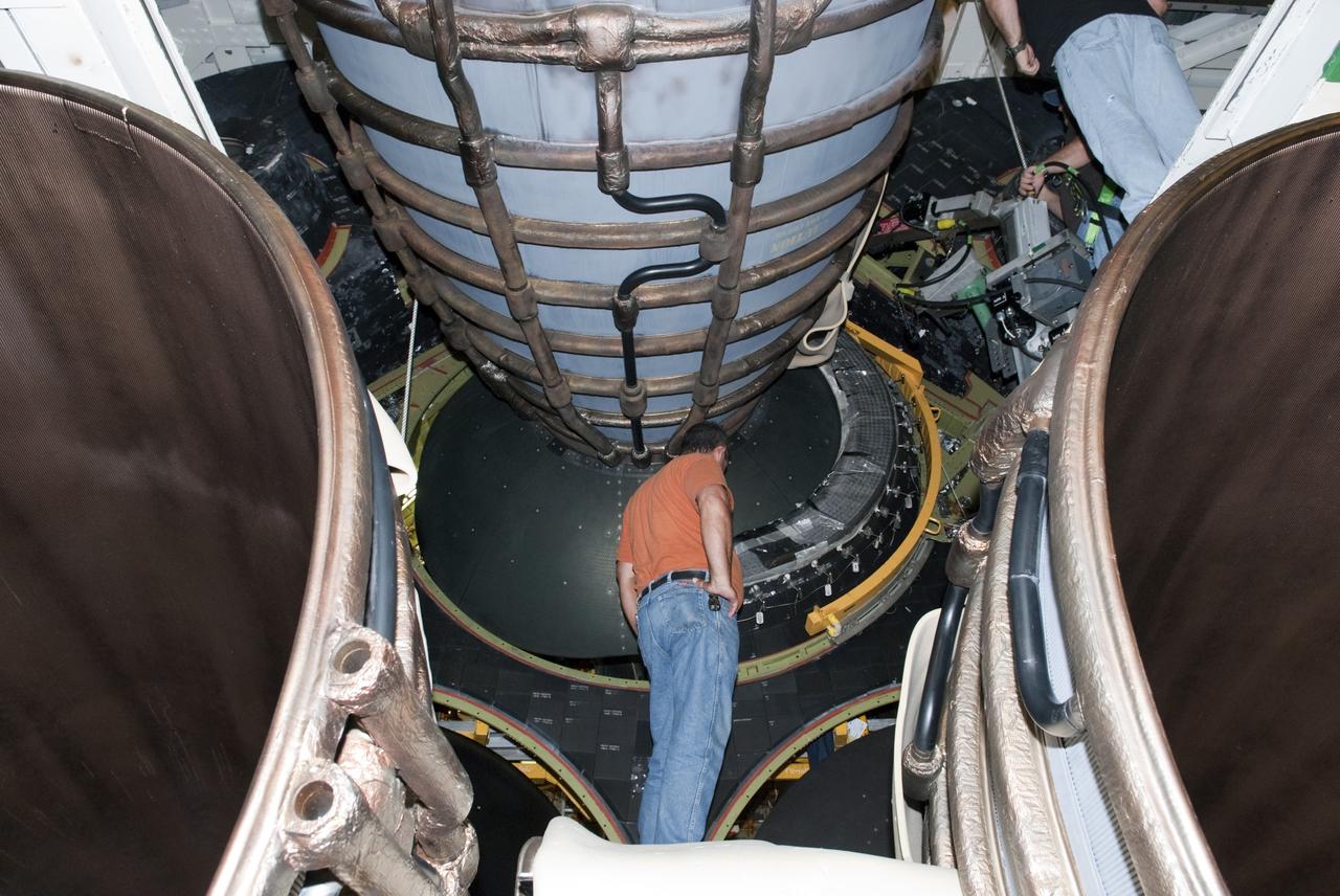 CAPE CANAVERAL, Fla. – In Orbiter Processing Facility Bay 2 at NASA’s Kennedy Space Center in Florida, United Space Alliance aerospace technician Tim Seymour inspects a heat shield that had just been installed around the base of space shuttle Endeavour’s replica shuttle main engine RSME number 1.      The work is part of Transition and Retirement of the remaining space shuttles, Endeavour and Atlantis. Endeavour is being prepared for public display at the California Science Center in Los Angeles. Its ferry flight to California is targeted for mid-September. Endeavour was the last space shuttle added to NASA’s orbiter fleet. Over the course of its 19-year career, Endeavour spent 299 days in space during 25 missions. For more information, visit http://www.nasa.gov/transition Photo credit: NASA/ Tim Jacobs