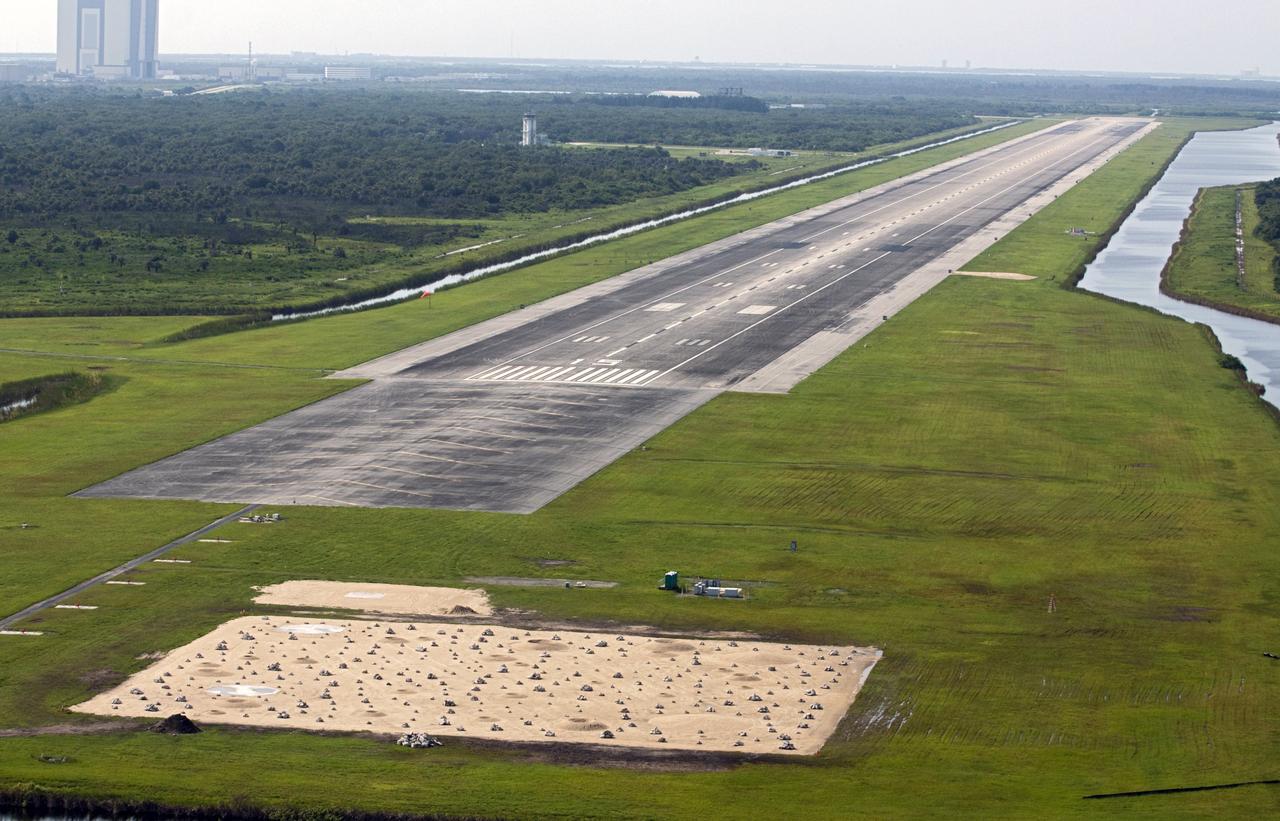 CAPE CANAVERAL, Fla. - Just north of the Kennedy Space Center’s Shuttle Landing Facility, or SLF, a rock and crater-filled planetary scape has been built so engineers can test the Autonomous Landing and Hazard Avoidance Technology, or ALHAT, system on the Project Morpheus lander. Testing will demonstrate ALHAT’s ability to provide required navigation data negotiating the Morpheus lander away from risks during descent. Checkout of the prototype lander has been ongoing at NASA’s Johnson Space Center in Houston in preparation for its first free flight. The SLF site will provide the lander with the kind of field necessary for realistic testing. Project Morpheus is one of 20 small projects comprising the Advanced Exploration Systems, or AES, program in NASA’s Human Exploration and Operations Mission Directorate. AES projects pioneer new approaches for rapidly developing prototype systems, demonstrating key capabilities and validating operational concepts for future human missions beyond Earth orbit. For more information on Project Morpheus, visit http://www.nasa.gov/centers/johnson/exploration/morpheus/index.html Photo credit: NASA/Kim Shiflett