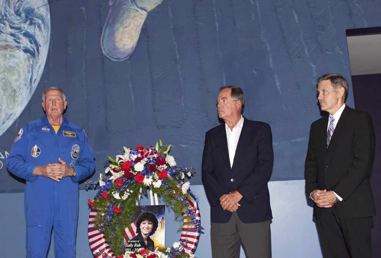 TITUSVILLE, Fla. - Former astronauts Jon McBride, left, and Bob Crippen, center, along with Kennedy Space Center director Bob Cabana, also a former astronaut, laid a wreath at the U. S. Astronaut Hall of Fame honoring Sally K. Ride, who became America's first woman in space in 1983. Following her death on July 23, 2012, Ride is being remembered for her service to NASA and for her efforts to encourage children to study math, science and technology. Crippen was commander on both of Ride's space shuttle missions. McBride was pilot on her second flight. Ride was inducted into the Astronaut Hall of Fame in 2003.      A California-born physicist, she broke the gender barrier 29 years ago when she rode to orbit aboard space shuttle Challenger on STS-7. Ride subsequently served, again as a mission specialist, on STS-41G in 1984. Following her career with NASA, in 2001 Ride founded her own company, Sally Ride Science, to pursue her long-time passion of motivating youth -- especially girls and young women -- to pursue careers in technical fields.  Photo credit: NASA/Jim Grossmann