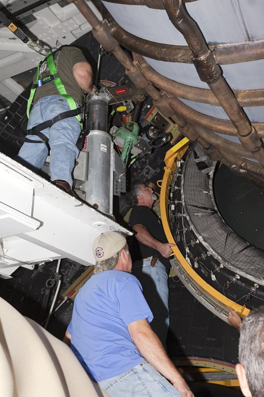 CAPE CANAVERAL, Fla. – In Orbiter Processing Facility Bay 2 at NASA’s Kennedy Space Center in Florida, United Space Alliance technicians install a heat shield around one of space shuttle Endeavour’s replica shuttle main engines.      The work is part of Transition and Retirement of the remaining space shuttles, Endeavour and Atlantis. Endeavour is being prepared for public display at the California Science Center in Los Angeles. Its ferry flight to California is targeted for mid-September. Endeavour was the last space shuttle added to NASA’s orbiter fleet. Over the course of its 19-year career, Endeavour spent 299 days in space during 25 missions. For more information, visit http://www.nasa.gov/transition Photo credit: NASA/ Frankie Martin