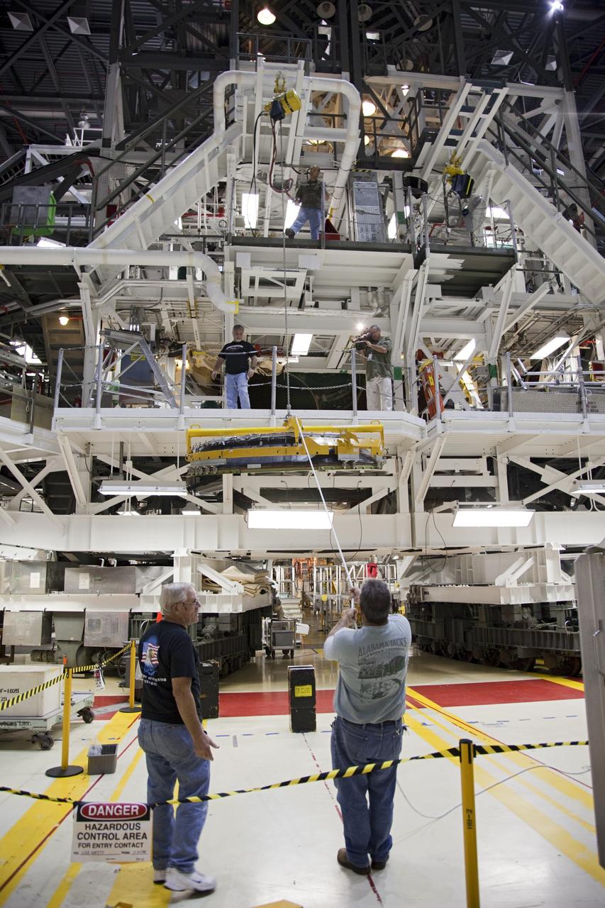 CAPE CANAVERAL, Fla. – In Orbiter Processing Facility Bay 2 at NASA’s Kennedy Space Center in Florida, United Space Alliance technicians lift a heat shield for installation around one of space shuttle Endeavour’s replica shuttle main engines.      The work is part of Transition and Retirement of the remaining space shuttles, Endeavour and Atlantis. Endeavour is being prepared for public display at the California Science Center in Los Angeles. Its ferry flight to California is targeted for mid-September. Endeavour was the last space shuttle added to NASA’s orbiter fleet. Over the course of its 19-year career, Endeavour spent 299 days in space during 25 missions. For more information, visit http://www.nasa.gov/transition Photo credit: NASA/ Frankie Martin