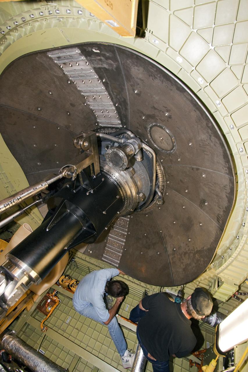 CAPE CANAVERAL, Fla. – United Space Alliance technicians secure a replica shuttle main engine dome heat shield inside the aft compartment of space shuttle Endeavour while work continues in Orbiter Processing Facility Bay 2 at NASA’s Kennedy Space Center in Florida.      The work is part of Transition and Retirement of the remaining space shuttles, Endeavour and Atlantis. Endeavour is being prepared for public display at the California Science Center in Los Angeles. Its ferry flight to California is targeted for mid-September. Endeavour was the last space shuttle added to NASA’s orbiter fleet. Over the course of its 19-year career, Endeavour spent 299 days in space during 25 missions. For more information, visit http://www.nasa.gov/transition Photo credit: NASA/ Jim Grossmann