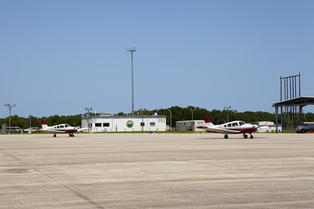 CAPE CANAVERAL, Fla. – At NASA Kennedy Space Center in Florida, flight instructors and their students from Florida Tech, or FIT, in Melbourne prepare to depart the Shuttle Landing Facility, or SLF, in Cherokee Warrior and Cessna 172S lightweight aircraft.    The middle and high school students are participating in FIT’s Av/Aero summer camp experience. They and their flight instructors toured the SLF midfield control tower, viewed F104 Starfighters and NASA Huey helicopters in the RLV Hangar, viewed the runway plaques marking wheels stop for each of the three space shuttles, and toured the Vehicle Assembly Building where space shuttle Atlantis currently is stored. Photo credit: NASA/Kim Shiflett