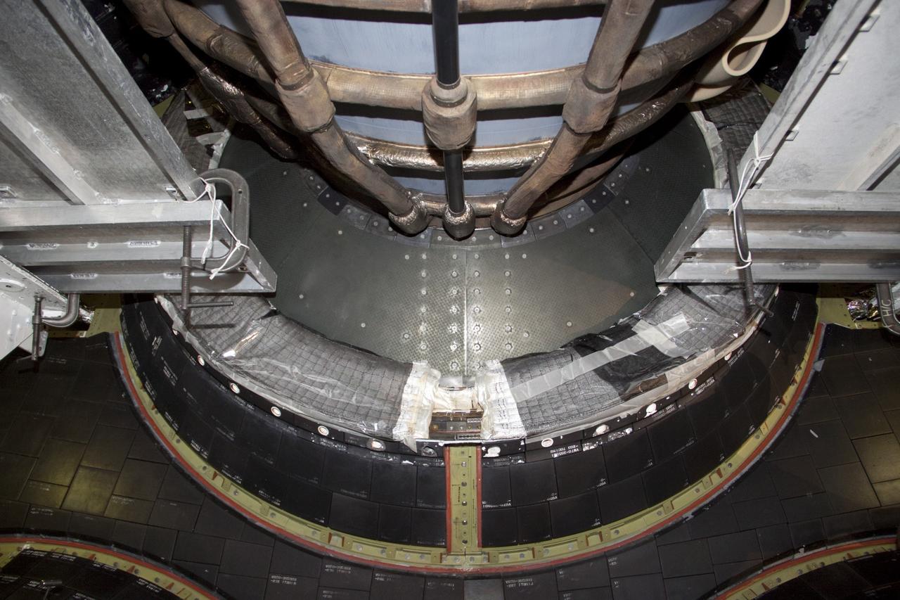 CAPE CANAVERAL, Fla. – In Orbiter Processing Facility Bay 2 at NASA’s Kennedy Space Center in Florida, heat shield tiles are being installed around the base of space shuttle Endeavour’s replica shuttle main engines.      The work is part of Transition and Retirement of the remaining space shuttles, Endeavour and Atlantis. Endeavour is being prepared for public display at the California Science Center in Los Angeles. Its ferry flight to California is targeted for mid-September. Endeavour was the last space shuttle added to NASA’s orbiter fleet. Over the course of its 19-year career, Endeavour spent 299 days in space during 25 missions. For more information, visit http://www.nasa.gov/transition Photo credit: NASA/ Jim Grossmann