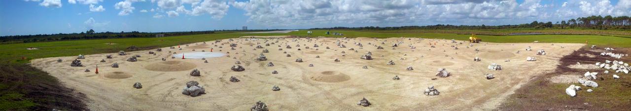 CAPE CANAVERAL, Fla. –This panoramic view shows a rock and crater-filled planetary scape has been built so engineers can test the Autonomous Landing and Hazard Avoidance Technology, or ALHAT system on the Project Morpheus lander. Testing will demonstrate ALHAT’s ability to provide required navigation data negotiating the Morpheus lander away from risks during descent.    Checkout of the prot  otype lander has been ongoing at NASA’s Johnson Space Center in Houston in preparation for its first free flight. The SLF site will provide the lander with the kind of field necessary for realistic testing. Project Morpheus is one of 20 small projects comprising the Advanced Exploration Systems, or AES, program in NASA’s Human Exploration and Operations Mission Directorate. AES projects pioneer new approaches for rapidly developing prototype systems, demonstrating key capabilities and validating operational concepts for future human missions beyond Earth orbit. For more information on Project Morpheus, visit http://www.nasa.gov/centers/johnson/exploration/morpheus/index.html  Photo credit: NASA/Kim Shiflett
