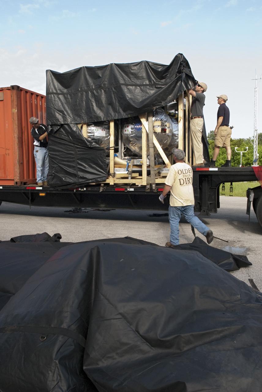 CAPE CANAVERAL, Fla. - NASA's Morpheus lander, a vertical test bed vehicle, is unloaded at the Kennedy Space Center in Florida. Morpheus is designed to demonstrate new green propellant propulsion systems and autonomous landing and an Autonomous Landing and Hazard Avoidance Technology, or ALHAT, system. Checkout of the prototype lander has been ongoing at NASA’s Johnson Space Center in Houston in preparation for its first free flight. The SLF site will provide the lander with the kind of field necessary for realistic testing. Project Morpheus is one of 20 small projects comprising the Advanced Exploration Systems, or AES, program in NASA’s Human Exploration and Operations Mission Directorate. AES projects pioneer new approaches for rapidly developing prototype systems, demonstrating key capabilities and validating operational concepts for future human missions beyond Earth orbit. For more information on Project Morpheus, visit http://www.nasa.gov/centers/johnson/exploration/morpheus/index.html Photo credit: NASA/ Charisse Nahser
