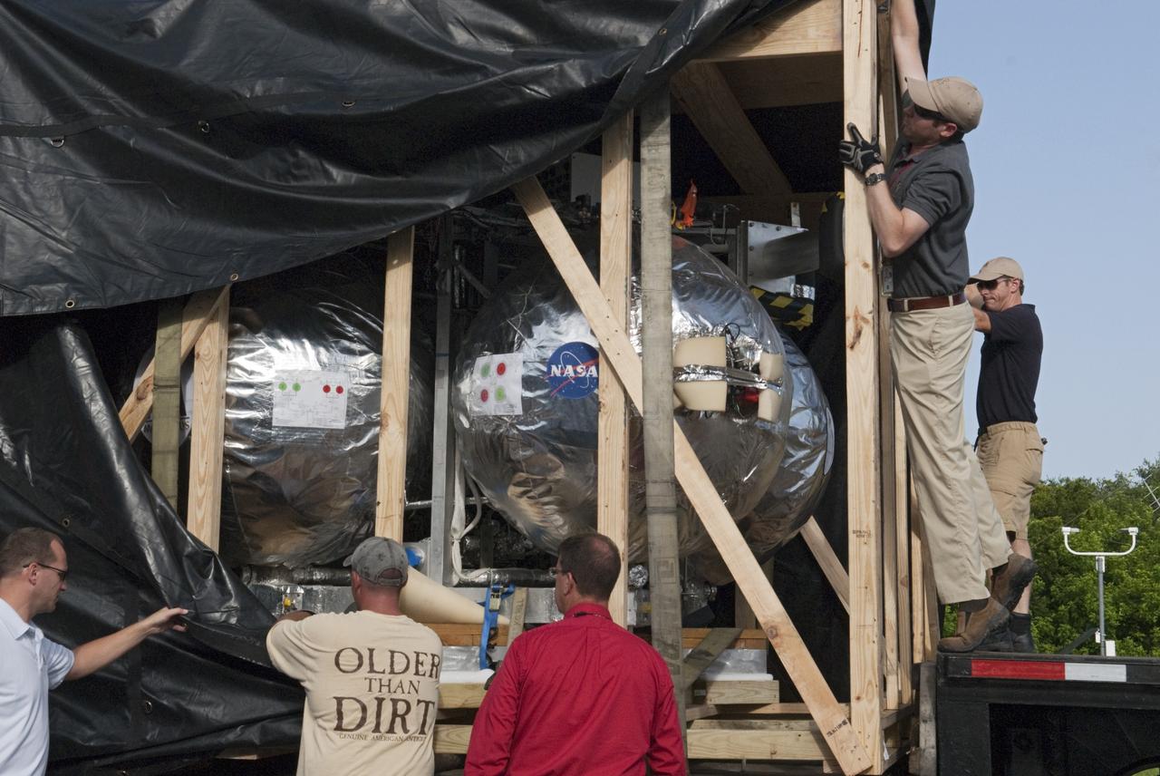 CAPE CANAVERAL, Fla. - NASA's Morpheus lander, a vertical test bed vehicle, is unloaded at the Kennedy Space Center in Florida. Morpheus is designed to demonstrate new green propellant propulsion systems and autonomous landing and an Autonomous Landing and Hazard Avoidance Technology, or ALHAT, system. Checkout of the prototype lander has been ongoing at NASA’s Johnson Space Center in Houston in preparation for its first free flight. The SLF site will provide the lander with the kind of field necessary for realistic testing. Project Morpheus is one of 20 small projects comprising the Advanced Exploration Systems, or AES, program in NASA’s Human Exploration and Operations Mission Directorate. AES projects pioneer new approaches for rapidly developing prototype systems, demonstrating key capabilities and validating operational concepts for future human missions beyond Earth orbit. For more information on Project Morpheus, visit http://www.nasa.gov/centers/johnson/exploration/morpheus/index.html Photo credit: NASA/ Charisse Nahser