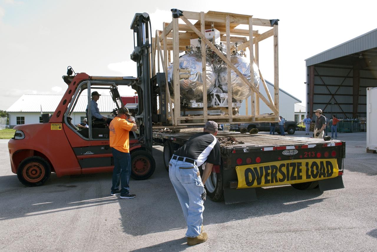 CAPE CANAVERAL, Fla. - A forklift is used at the Kennedy Space Center in Florida to unload NASA's Morpheus lander, a vertical test bed vehicle. Morpheus is designed to demonstrate new green propellant propulsion systems and autonomous landing and an Autonomous Landing and Hazard Avoidance Technology, or ALHAT, system.      Checkout of the prototype lander has been ongoing at NASA’s Johnson Space Center in Houston in preparation for its first free flight. The SLF site will provide the lander with the kind of field necessary for realistic testing. Project Morpheus is one of 20 small projects comprising the Advanced Exploration Systems, or AES, program in NASA’s Human Exploration and Operations Mission Directorate. AES projects pioneer new approaches for rapidly developing prototype systems, demonstrating key capabilities and validating operational concepts for future human missions beyond Earth orbit. For more information on Project Morpheus, visit http://www.nasa.gov/centers/johnson/exploration/morpheus/index.html  Photo credit: NASA/ Charisse Nahser