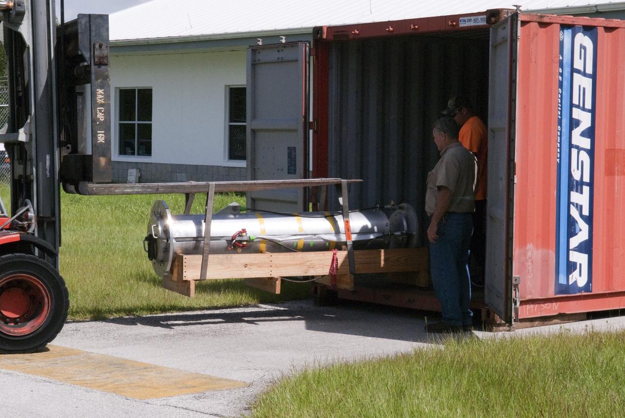 CAPE CANAVERAL, Fla. - Support equipment for NASA's Morpheus lander, a vertical test bed vehicle, is unloaded at a building at the Shuttle Landing Facility, or SLF, at the Kennedy Space Center in Florida. Morpheus is designed to demonstrate new green propellant propulsion systems and autonomous landing and an Autonomous Landing and Hazard Avoidance Technology, or ALHAT, system. Checkout of the prototype lander has been ongoing at NASA’s Johnson Space Center in Houston in preparation for its first free flight. The SLF site will provide the lander with the kind of field necessary for realistic testing. Project Morpheus is one of 20 small projects comprising the Advanced Exploration Systems, or AES, program in NASA’s Human Exploration and Operations Mission Directorate. AES projects pioneer new approaches for rapidly developing prototype systems, demonstrating key capabilities and validating operational concepts for future human missions beyond Earth orbit. For more information on Project Morpheus, visit http://www.nasa.gov/centers/johnson/exploration/morpheus/index.html Photo credit: NASA/ Charisse Nahser