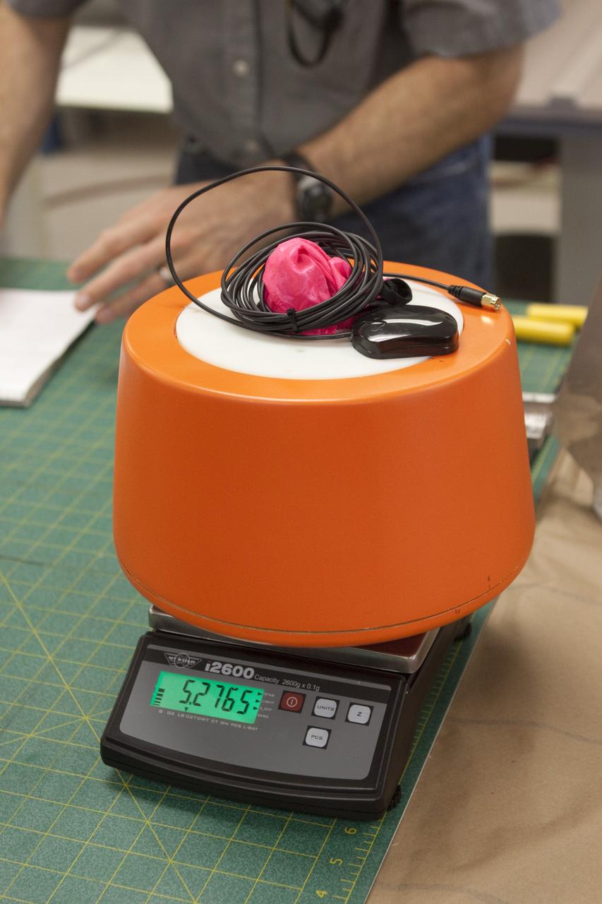 CAPE CANAVERAL, Fla. – The instrument package and capsule built by Rocket University participants for a high-altitude balloon flight. The test flight was used to evaluate the stability of an instrumented capsule as it fell to Earth before its parachute opened. Rocket University is a program of courses, workshops, labs and projects offered to engineering and research pros of all stripes to keep their skills fresh and broaden their experiences. Photo credit: NASA/Jim Grossmann