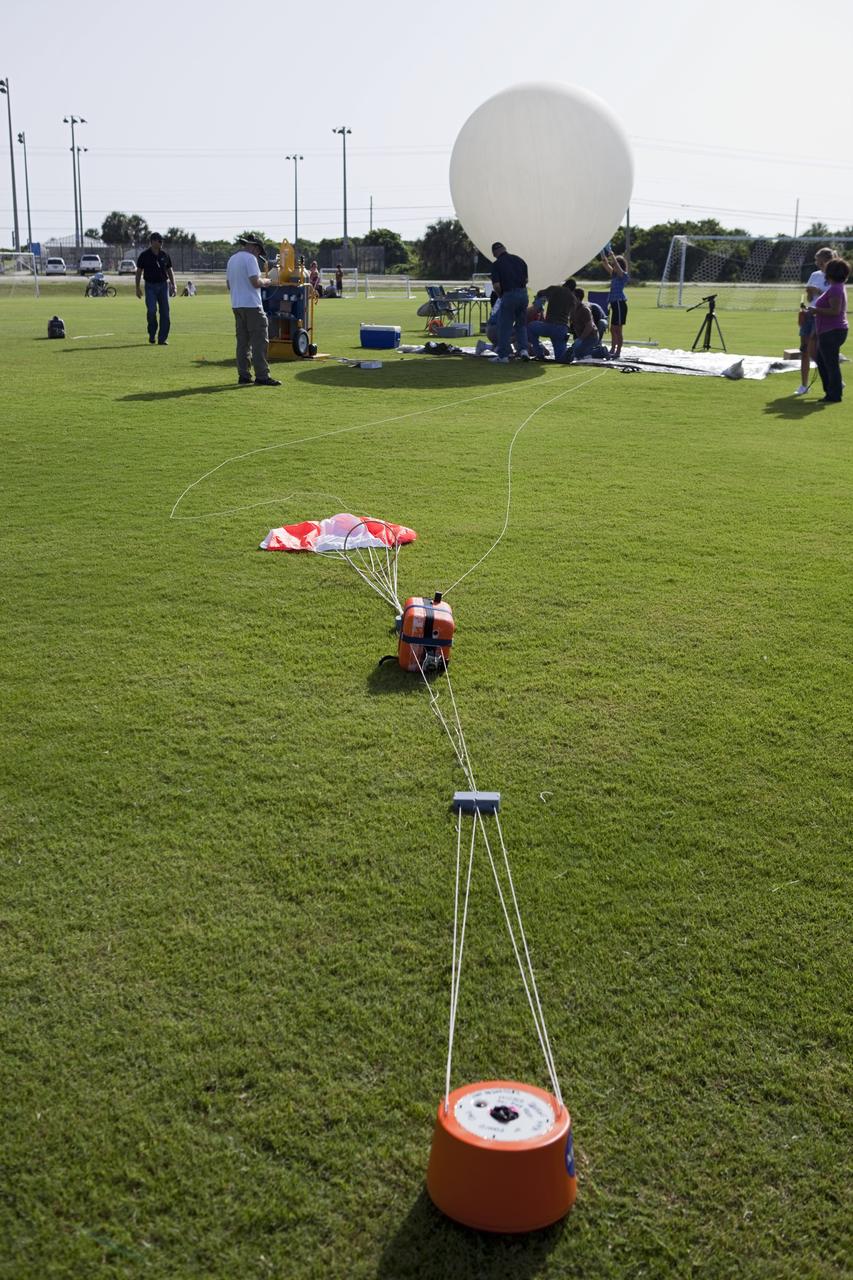 CAPE CANAVERAL, Fla. – The instrument package built by Rocket University participants for a high-altitude balloon flight sits on the ground moments before launch. The test flight was used to evaluate the stability of an instrumented capsule as it fell to Earth before its parachute opened. Rocket University is a program of courses, workshops, labs and projects offered to engineering and research pros of all stripes to keep their skills fresh and broaden their experiences. Photo credit: NASA/Jim Grossmann