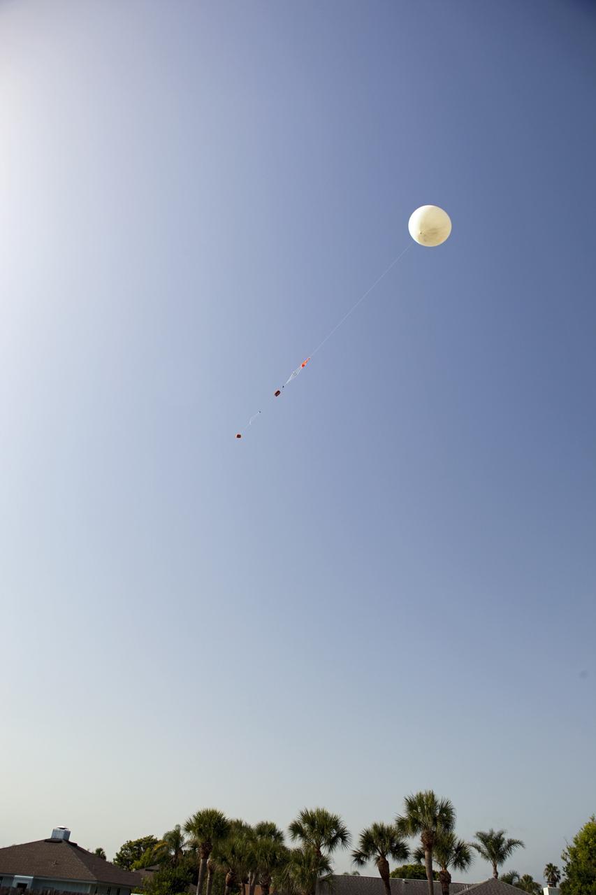 CAPE CANAVERAL, Fla. – Rocket University participants launch a high-altitude balloon flight and instrument package. The test flight was used to evaluate the stability of an instrumented capsule as it fell to Earth before its parachute opened. Rocket University is a program of courses, workshops, labs and projects offered to engineering and research pros of all stripes to keep their skills fresh and broaden their experiences. Photo credit: NASA/Jim Grossmann