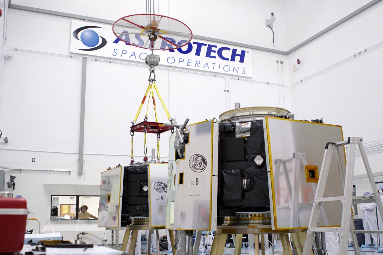 TITUSVILLE, Fla. - Inside the Astrotech payload processing facility in Titusville, Fla. near NASA’s Kennedy Space Center, a crane has been attached to the Radiation Belt Storm Probes, or RBSP, spacecraft A prior to vertical stacking atop RBSP B. NASA’s RBSP mission will help us understand the sun’s influence on Earth and near-Earth space by studying the Earth’s radiation belts on various scales of space and time. RBSP will begin its mission of exploration of Earth’s Van Allen radiation belts and the extremes of space weather after its liftoff aboard a United Launch Alliance Atlas V from Space Launch Complex 41 at Cape Canaveral Air Force Station, Fla. Liftoff is targeted for Aug. 23, 2012. For more information, visit http://www.nasa.gov/rbsp. Photo credit: NASA/Jim Grossmann