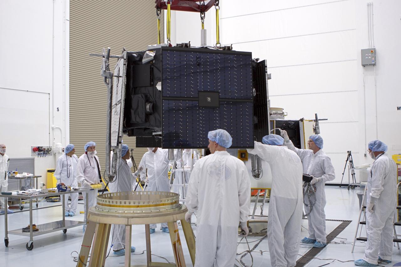 TITUSVILLE, Fla. - Inside the Astrotech payload processing facility in Titusville, Fla. near NASA’s Kennedy Space Center, technicians use a crane to lift the Radiation Belt Storm Probes, or RBSP, spacecraft A for stacking atop RBSP B.      NASA’s RBSP mission will help us understand the sun’s influence on Earth and near-Earth space by studying the Earth’s radiation belts on various scales of space and time. RBSP will begin its mission of exploration of Earth’s Van Allen radiation belts and the extremes of space weather after its liftoff aboard a United Launch Alliance Atlas V from Space Launch Complex 41 at Cape Canaveral Air Force Station, Fla. Liftoff is targeted for Aug. 23, 2012. For more information, visit http://www.nasa.gov/rbsp. Photo credit: NASA/Jim Grossmann