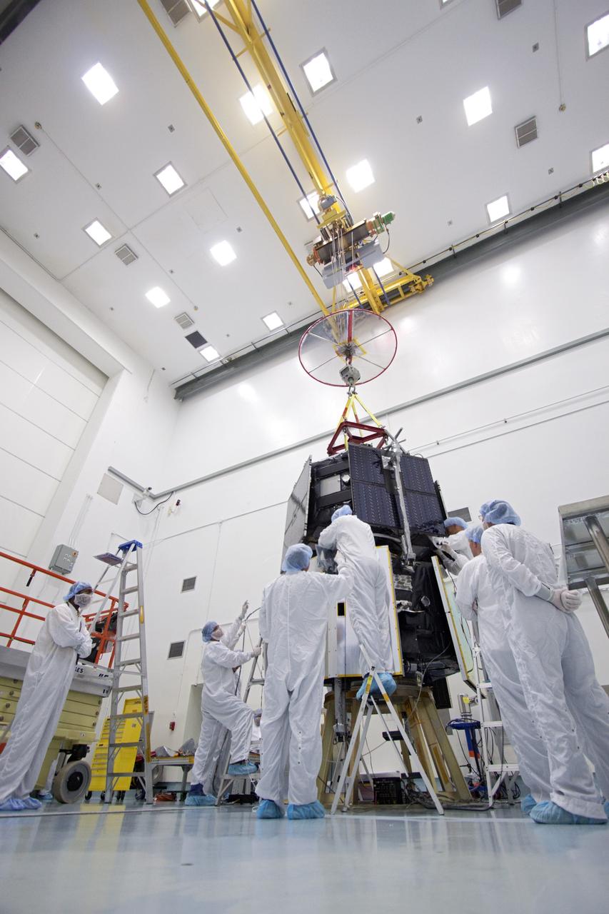 TITUSVILLE, Fla. - Inside the Astrotech payload processing facility in Titusville, Fla. near NASA’s Kennedy Space Center, technicians use a crane to position the Radiation Belt Storm Probes, or RBSP, spacecraft A atop RBSP B.      NASA’s RBSP mission will help us understand the sun’s influence on Earth and near-Earth space by studying the Earth’s radiation belts on various scales of space and time. RBSP will begin its mission of exploration of Earth’s Van Allen radiation belts and the extremes of space weather after its liftoff aboard a United Launch Alliance Atlas V from Space Launch Complex 41 at Cape Canaveral Air Force Station, Fla. Liftoff is targeted for Aug. 23, 2012. For more information, visit http://www.nasa.gov/rbsp. Photo credit: NASA/Jim Grossmann