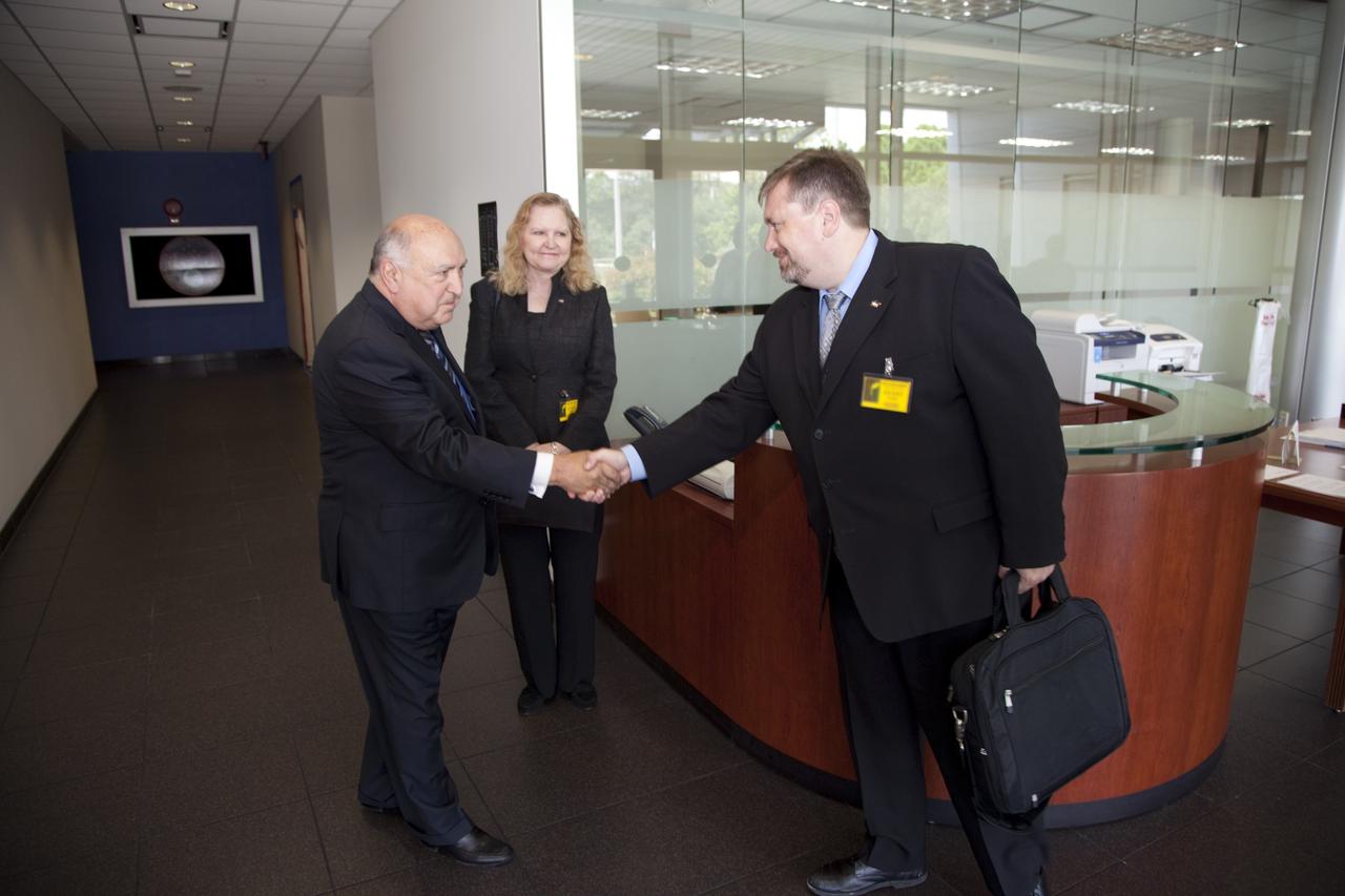 CAPE CANAVERAL, Fla. – Dr. Mason Peck, right, NASA's chief Technologist, greets Frank DiBello, president and CEO of Space Florida as Karen L. Thompson, chief technologist for Kennedy Space Center, looks on. Space Florida manages the Space Life Sciences Laboratory at Kennedy. Peck toured the lab facility during a visit to the space center. Photo credit: NASA/Frankie Martin