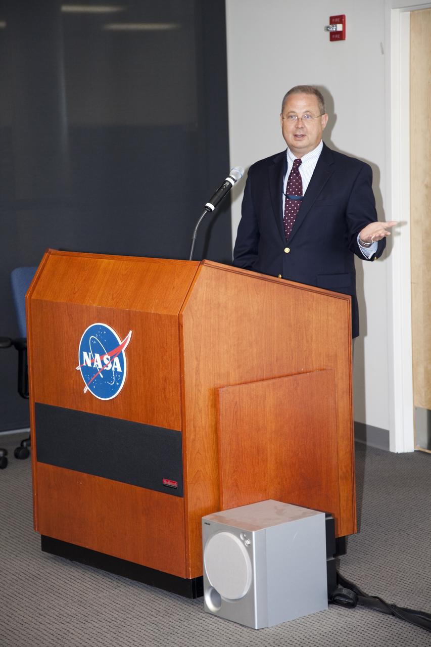 CAPE CANAVERAl, Fla. - James Stanley, chief technologist for Qinetiq North America, speaks during a visit by Dr. Mason Peck, NASA's chief Technologist, to Kennedy Space Center's Space Life Sciences Laboratory. Peck toured the lab facility during a visit to the space center. Photo credit: NASA/Frankie Martin
