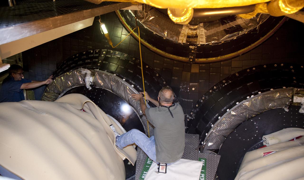 CAPE CANAVERAL, Fla. – In Orbiter Processing Facility Bay 2 at NASA’s Kennedy Space Center in Florida, a United Space Alliance technician installs an outer heat shield carrier panel on the space shuttle Endeavour.      The work is part of Transition and Retirement of the remaining space shuttles, Endeavour and Atlantis. Endeavour is being prepared for public display at the California Science Center in Los Angeles. Its ferry flight to California is targeted for mid-September. Endeavour was the last space shuttle added to NASA’s orbiter fleet. Over the course of its 19-year career, Endeavour spent 299 days in space during 25 missions. For more information, visit http://www.nasa.gov/transition Photo credit: NASA/ Frankie Martin