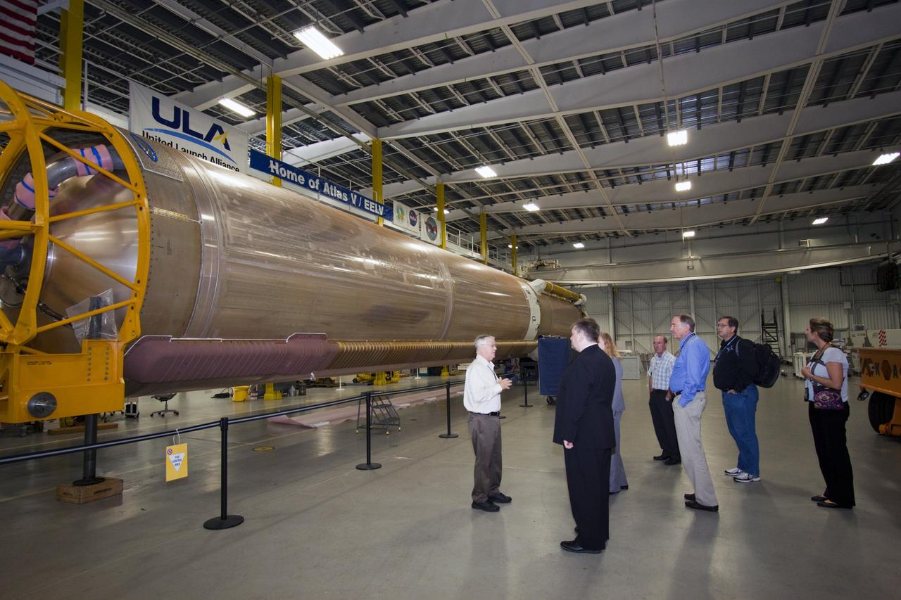 CAPE CANAVERAL, Fla. – Mike Woolley of the United Launch Alliance, left, shows an Atlas V rocket to Dr. Mason Peck, NASA's chief technologist, during Peck's visit to Cape Canaveral Air Force Station in Florida. Photo credit: NASA/Jim Grossman