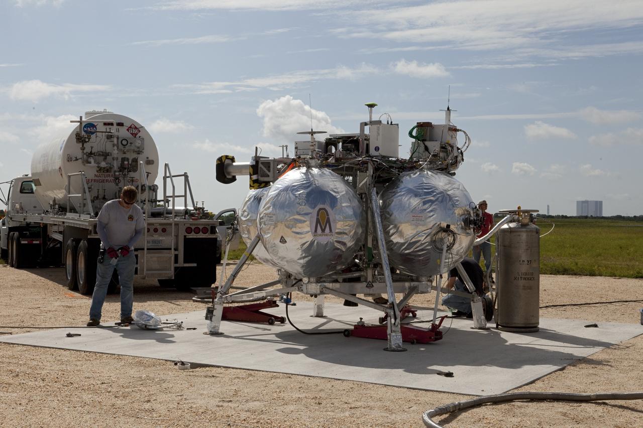 CAPE CANAVERAL, Fla. - At the north end of the Shuttle Landing Facility, or SLF, at the Kennedy Space Center in Florida, NASA's Morpheus lander, a vertical test bed vehicle is being checked out. A rock and crater-filled planetary scape, has been built so engineers can test the Autonomous Landing and Hazard Avoidance Technology, or ALHAT, system on the Project Morpheus lander. Checkout of the prototype lander has been ongoing at NASA’s Johnson Space Center in Houston in preparation for its first free flight. The SLF site will provide the lander with the kind of field necessary for realistic testing. Project Morpheus is one of 20 small projects comprising the Advanced Exploration Systems, or AES, program in NASA’s Human Exploration and Operations Mission Directorate. AES projects pioneer new approaches for rapidly developing prototype systems, demonstrating key capabilities and validating operational concepts for future human missions beyond Earth orbit. For more information on Project Morpheus, visit http://www.nasa.gov/centers/johnson/exploration/morpheus/index.html Photo credit: NASA/Kim Shiflett