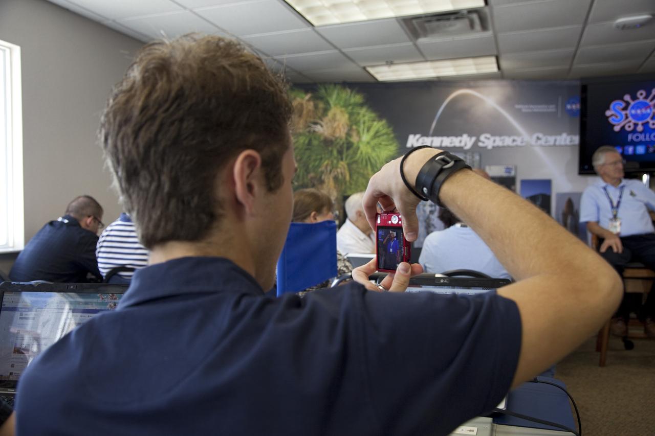 CAPE CANAVERAL, Fla. -- One of about 45 of NASA’s social media followers photographs a speaker during two days of presentations on the Kennedy Space Center's past, present and future.      The social media participants gathered at the Florida spaceport on Aug. 2 and 3, 2012 to hear from key former and current leaders who related stories of the space agency's efforts to explore the unknown. It was the first social media event totally run by Kennedy. Photo credit: NASA/ Gianni Woods