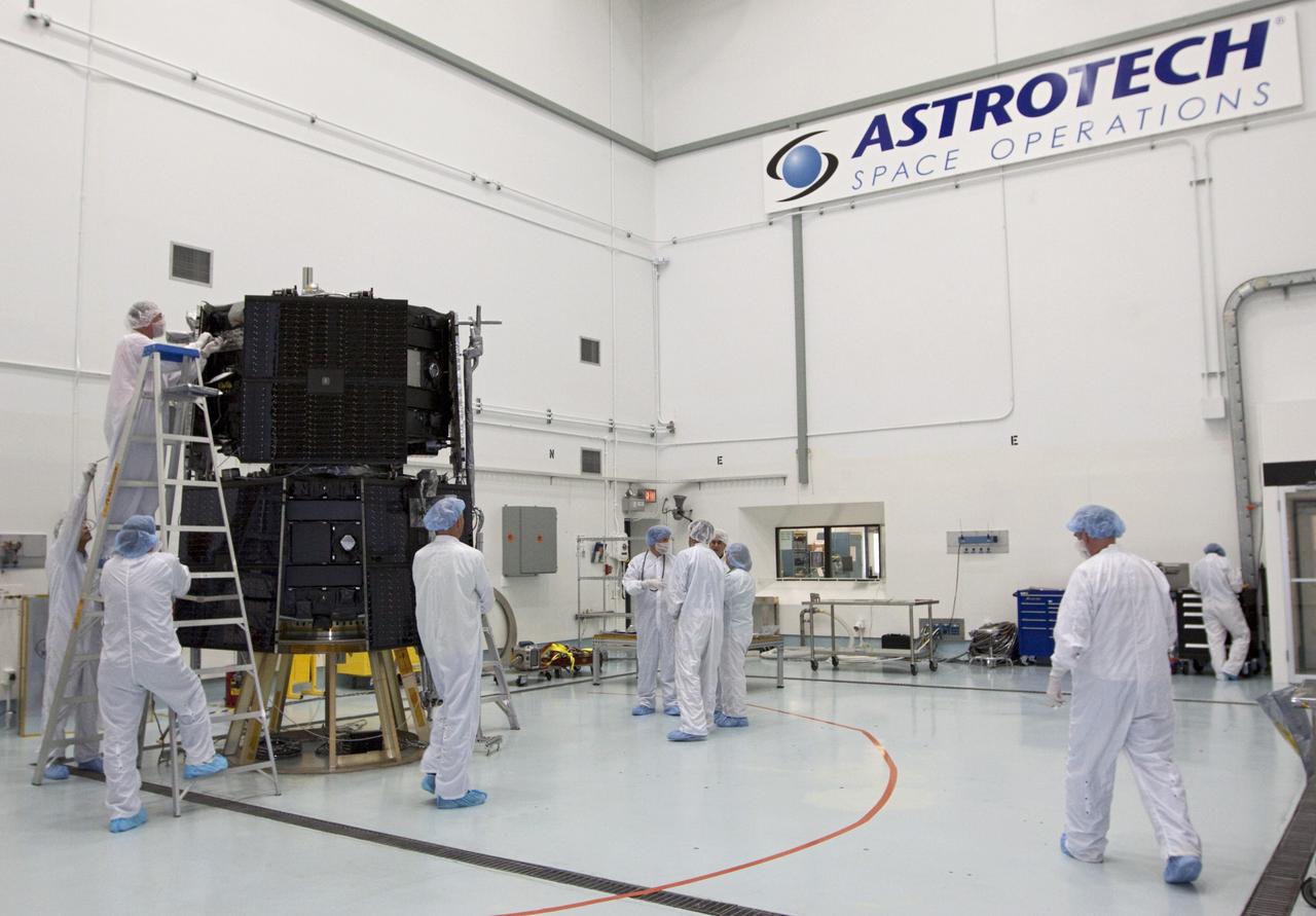 CAPE CANAVERAL, Fla. - Inside the Astrotech payload processing facility near NASA’s Kennedy Space Center in Florida, technicians work on the Radiation Belt Storm Probes, or RBSP, spacecraft. NASA’s RBSP mission will help us understand the sun’s influence on Earth and near-Earth space by studying the Earth’s radiation belts on various scales of space and time. As the spacecraft orbits Earth, the four solar panels will continuously face the sun to provide constant power to its instruments. The boom will provide data of the electric fields that energize radiation particles and modify the structure of the inner magnetosphere. RBSP will begin its mission of exploration of Earth’s Van Allen radiation belts and the extremes of space weather after its launch aboard a United Launch Alliance Atlas V rocket. Launch is targeted for Aug. 23. For more information, visit http://www.nasa.gov/rbsp. Photo credit: NASA/Kim Shiflett