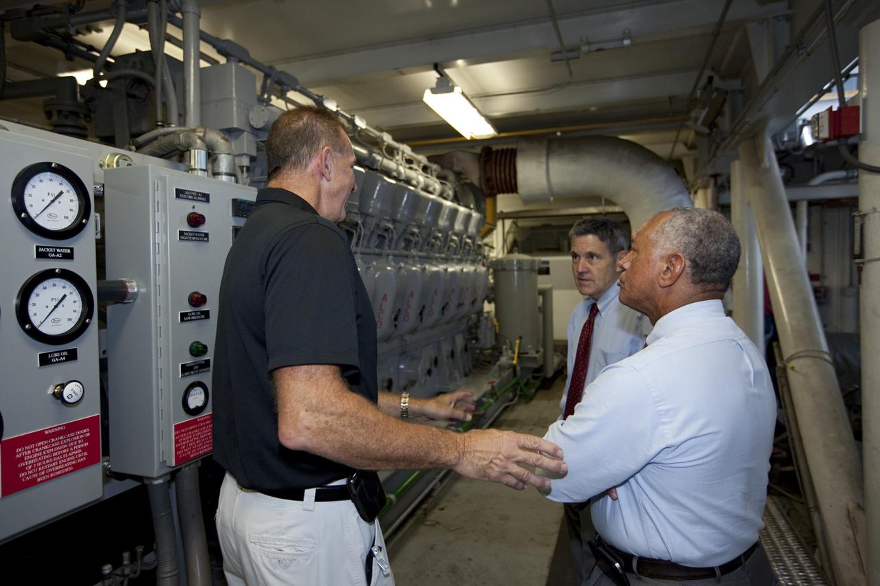 Cape Canaveral Air Force Station, Fla. -- NASA Administrator Charlie Bolden, accompanied by Center Director Bob Cabana, sees firsthand how NASA's Kennedy Space Center is transiting to a spaceport of the future as Kennedy's Mike Parrish explains the upcoming uses for the crawler-transporter that has carried space vehicles to the launch pad since the Apollo Program.        NASA is working with U.S. industry partners to develop commercial spaceflight capabilities to low Earth orbit as the agency also is developing the Orion Multi-Purpose Crew Vehicle MPCV and the Space Launch System SLS, a crew capsule and heavy-lift rocket to provide an entirely new capability for human exploration. Designed to be flexible for launching spacecraft for crew and cargo missions, SLS and Orion MPCV will expand human presence beyond low Earth orbit and enable new missions of exploration across the solar system.    Photo credit: NASA/Kim Shiflett