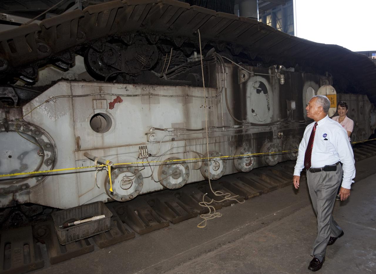 Cape Canaveral Air Force Station, Fla. -- NASA Administrator Charlie Bolden sees firsthand how NASA's Kennedy Space Center is transiting to a spaceport of the future as he gets a close look at the crawler-transporter that has carried space vehicles to the launch pad since the Apollo Program. NASA is working with U.S. industry partners to develop commercial spaceflight capabilities to low Earth orbit as the agency also is developing the Orion Multi-Purpose Crew Vehicle MPCV and the Space Launch System SLS, a crew capsule and heavy-lift rocket to provide an entirely new capability for human exploration. Designed to be flexible for launching spacecraft for crew and cargo missions, SLS and Orion MPCV will expand human presence beyond low Earth orbit and enable new missions of exploration across the solar system. Photo credit: NASA/Kim Shiflett