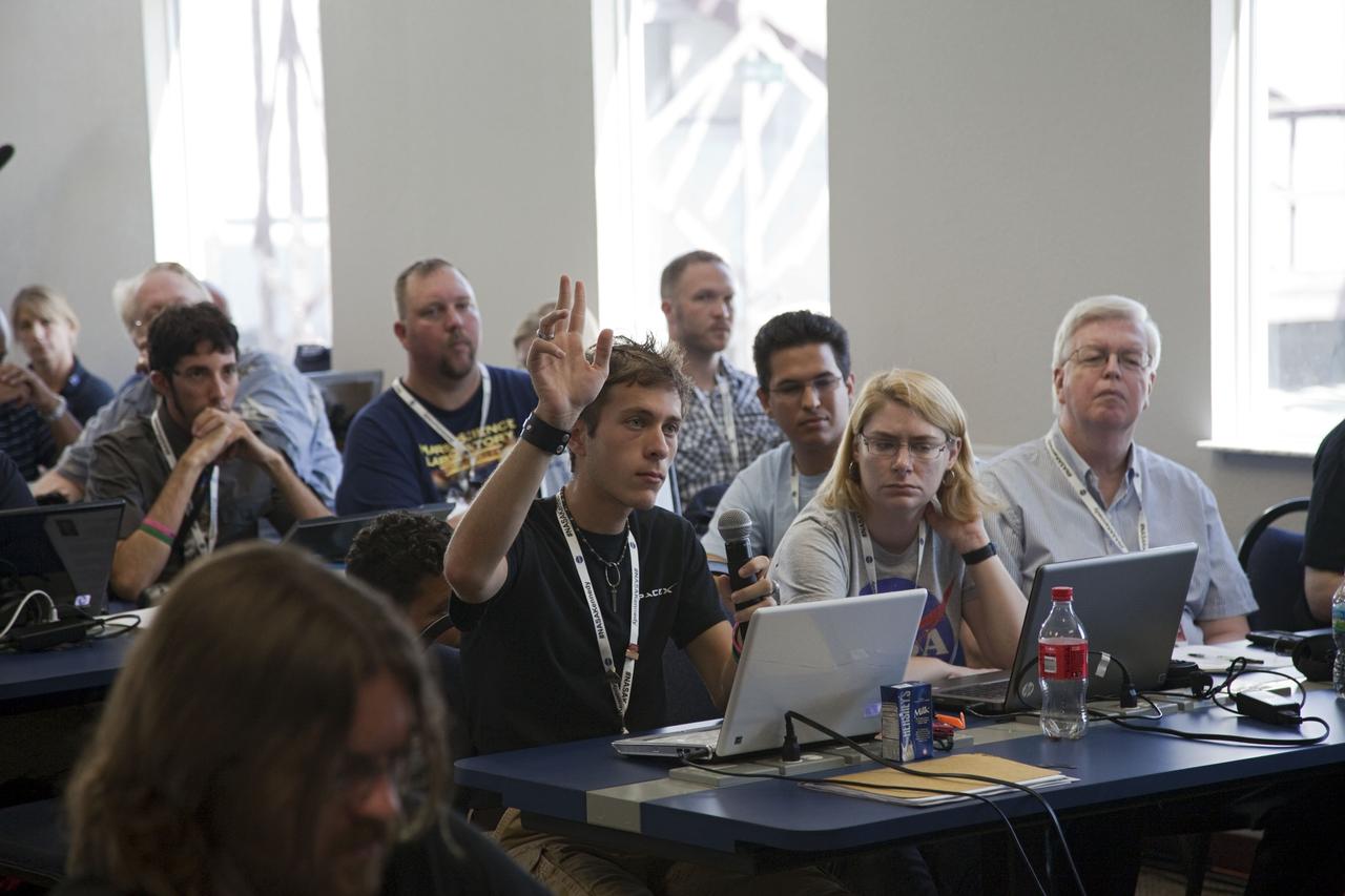 CAPE CANAVERAL, Fla. -- One of about 45 of NASA’s social media followers asks a question during two days of presentations on the Kennedy Space Center's past, present and future.      The social media participants gathered at the Florida spaceport on Aug. 2 and 3, 2012 to hear from key former and current leaders who related stories of the space agency's efforts to explore the unknown. It was the first social media event totally run by Kennedy. Photo credit: NASA/ Gianni Woods