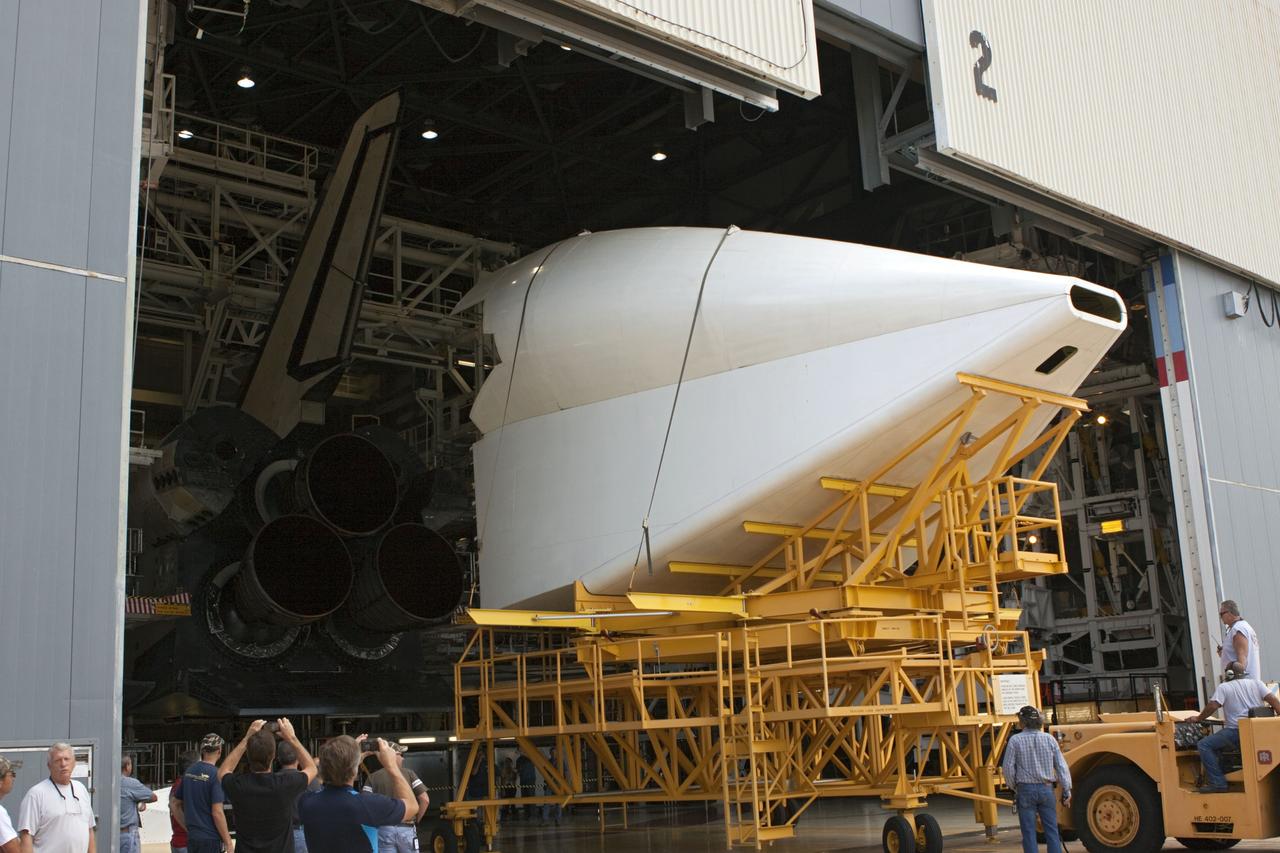 CAPE CANAVERAL, Fla. -- The tail cone that will cover space shuttle Endeavour’s replica shuttle main engines arrives at Orbiter Processing Facility-2, or OPF-2, from the Vehicle Assembly Building at NASA’s Kennedy Space Center in Florida. Inside OPF-2, the tail cone will be installed on Endeavour.    The work is part of Transition and Retirement of the remaining space shuttles, Endeavour and Atlantis. Endeavour is being prepared for public display at the California Science Center in Los Angeles. Its ferry flight to California is targeted for mid-September. Endeavour was the last space shuttle added to NASA’s orbiter fleet. Over the course of its 19-year career, Endeavour spent 299 days in space during 25 missions. For more information, visit http://www.nasa.gov/shuttle.  Photo credit: NASA/Jim Grossmann