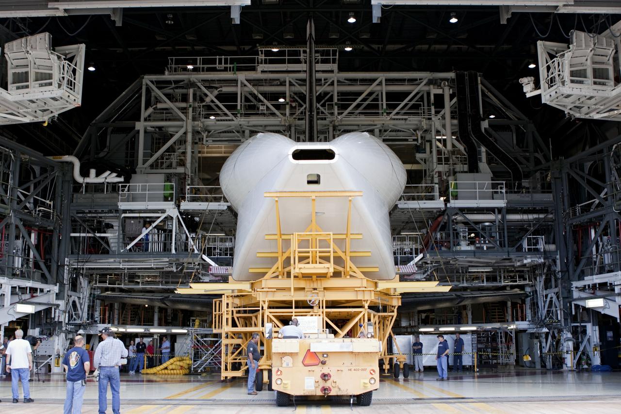 CAPE CANAVERAL, Fla. -- The tail cone that will cover space shuttle Endeavour’s replica shuttle main engines arrives at Orbiter Processing Facility-2, or OPF-2, from the Vehicle Assembly Building at NASA’s Kennedy Space Center in Florida. Inside OPF-2, the tail cone will be installed on Endeavour.    The work is part of Transition and Retirement of the remaining space shuttles, Endeavour and Atlantis. Endeavour is being prepared for public display at the California Science Center in Los Angeles. Its ferry flight to California is targeted for mid-September. Endeavour was the last space shuttle added to NASA’s orbiter fleet. Over the course of its 19-year career, Endeavour spent 299 days in space during 25 missions. For more information, visit http://www.nasa.gov/shuttle.  Photo credit: NASA/Jim Grossmann