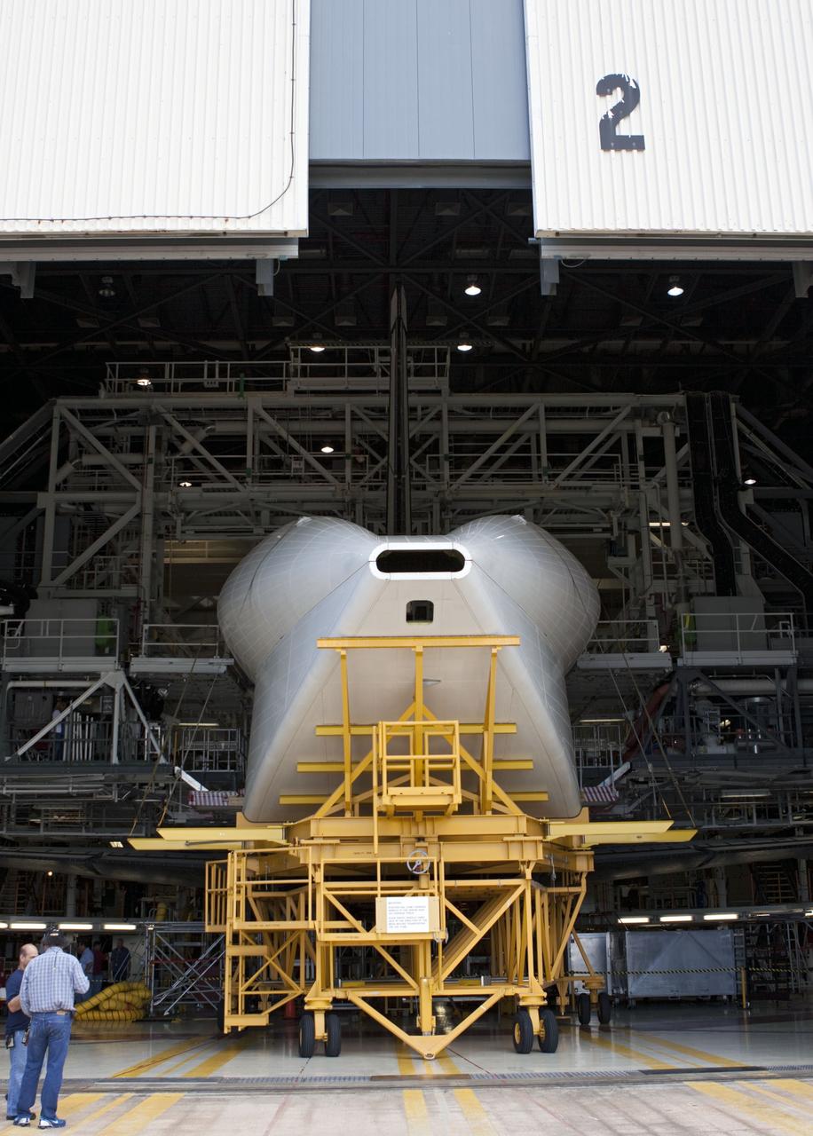 CAPE CANAVERAL, Fla. -- The tail cone that will cover space shuttle Endeavour’s replica shuttle main engines arrives at Orbiter Processing Facility-2, or OPF-2, from the Vehicle Assembly Building at NASA’s Kennedy Space Center in Florida. Inside OPF-2, the tail cone will be installed on Endeavour.    The work is part of Transition and Retirement of the remaining space shuttles, Endeavour and Atlantis. Endeavour is being prepared for public display at the California Science Center in Los Angeles. Its ferry flight to California is targeted for mid-September. Endeavour was the last space shuttle added to NASA’s orbiter fleet. Over the course of its 19-year career, Endeavour spent 299 days in space during 25 missions. For more information, visit http://www.nasa.gov/shuttle.  Photo credit: NASA/Jim Grossmann