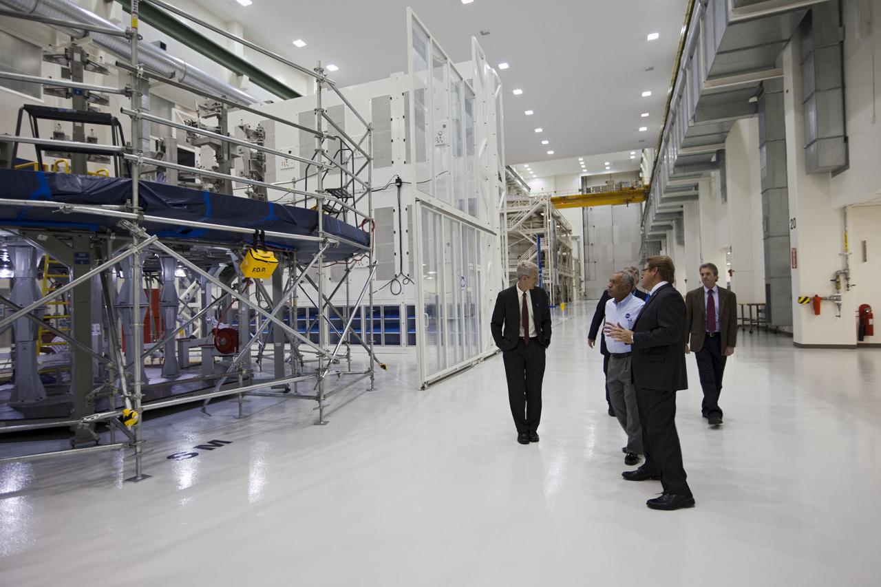 CAPE CANAVERAL, Fla. – Charles Bolden, NASA administrator, center, is shown the high bay at the Operations and Checkout Building at NASA's Kennedy Space Center in Florida by NASA's Scott Wilson, left, and Lockheed Martin's Jules Schneider, foreground. Lockheed Martin is processing an Orion spacecraft that will make an uncrewed flight test in 2014. Photo credit: NASA/Kim Shifflett