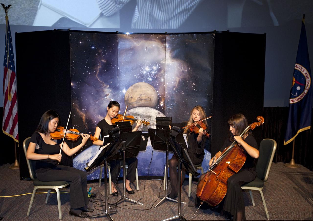 CAPE CANAVERAL, Fla. – A string quartet from the Brevard Symphony Orchestra performed for graduates and guests at the closing ceremonies for the International Space University at the Kennedy Space center Visitor Complex on Aug. 3, 2012.      The International Space University is a nine-week intensive course designed for post-graduate university students and professionals during the summer. The program is hosted by a different country each year, providing a unique educational experience for participants from around the world. NASA Kennedy Space Center and the Florida Institute of Technology co-hosted this year's event which ran from June 4 to Aug. 3. There were about 125 participants representing 31 countries. For more information, visit http://www.isunet.edu Photo credit: NASA/Kim Shiflett