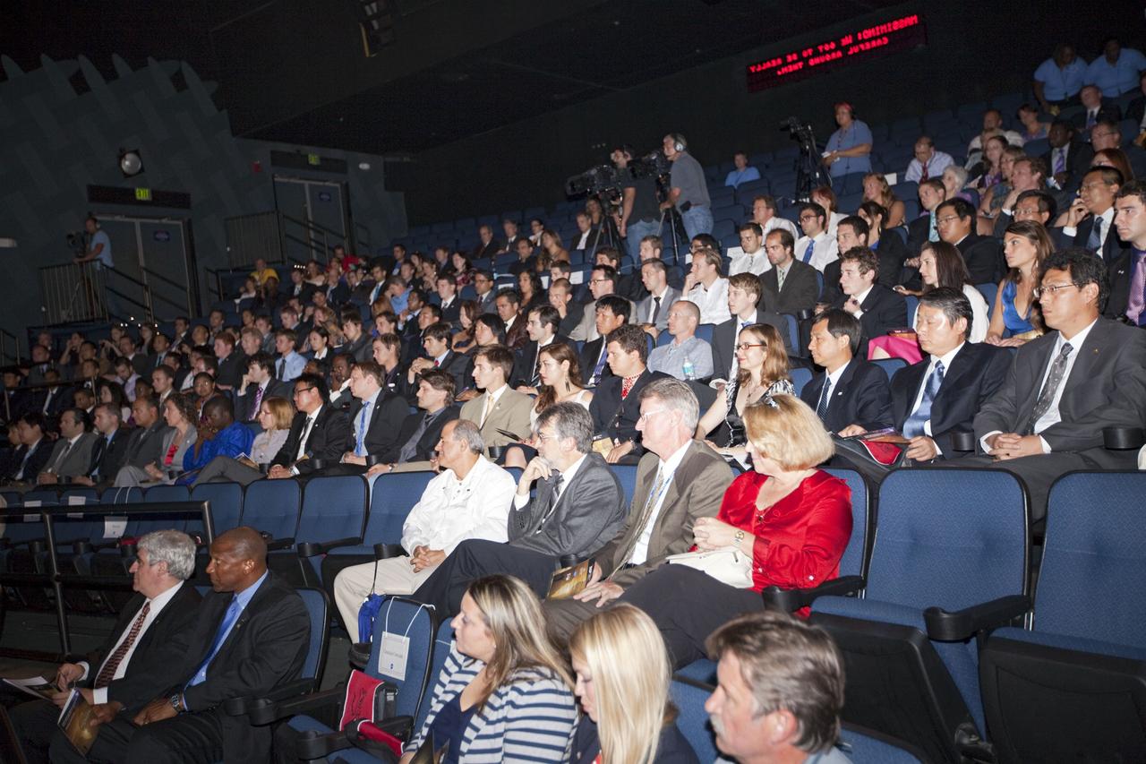 CAPE CANAVERAL, Fla. – Graduates and guests gather for the closing ceremonies for the International Space University at the Kennedy Space center Visitor Complex on Aug. 3, 2012.      The International Space University is a nine-week intensive course designed for post-graduate university students and professionals during the summer. The program is hosted by a different country each year, providing a unique educational experience for participants from around the world. NASA Kennedy Space Center and the Florida Institute of Technology co-hosted this year's event which ran from June 4 to Aug. 3. There were about 125 participants representing 31 countries. For more information, visit http://www.isunet.edu Photo credit: NASA/Kim Shiflett