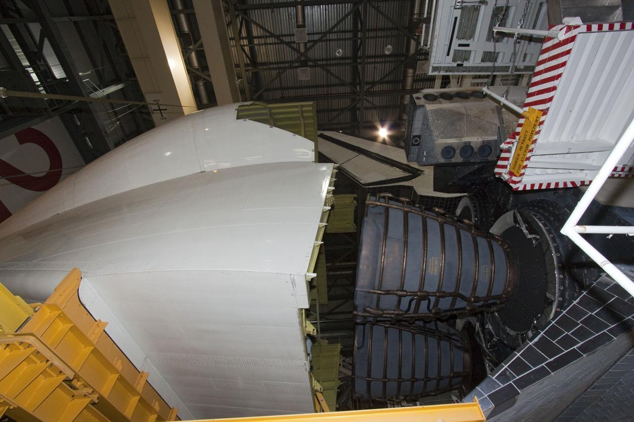 CAPE CANAVERAL, Fla. – In Orbiter Processing Facility Bay 2 at NASA’s Kennedy Space Center in Florida, the tail cone approaches the replica main engines at it is moved into position for attachment to the space shuttle Endeavour. The tail cone covers the main engines in the aft providing aerodynamic stability during the cross-country ferry flight.      The work is part of Transition and Retirement of the remaining space shuttles, Endeavour and Atlantis. Endeavour is being prepared for public display at the California Science Center in Los Angeles. Its ferry flight to California is targeted for mid-September. Endeavour was the last space shuttle added to NASA’s orbiter fleet. Over the course of its 19-year career, Endeavour spent 299 days in space during 25 missions. For more information, visit http://www.nasa.gov/transition Photo credit: NASA/ Jim Grossmann