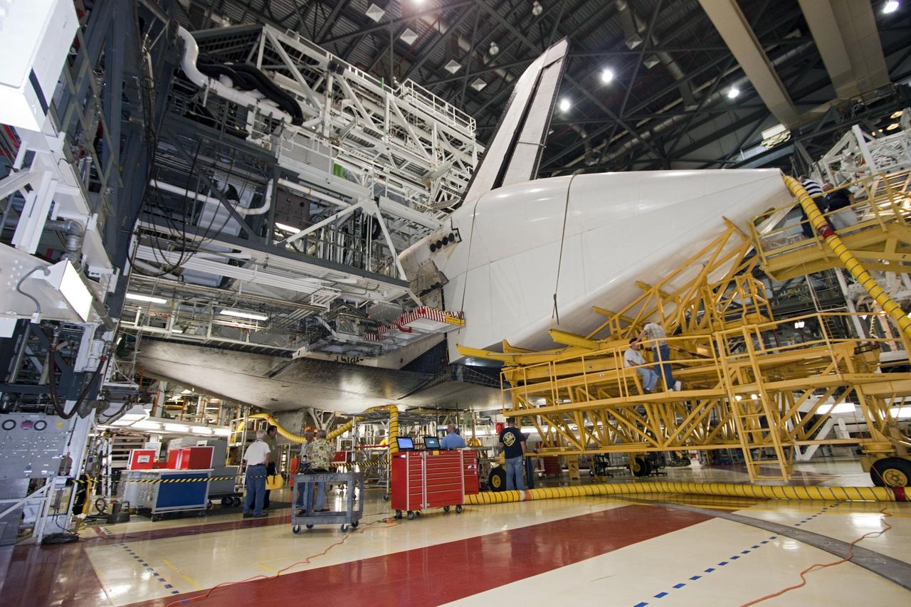 CAPE CANAVERAL, Fla. – In Orbiter Processing Facility Bay 2 at NASA’s Kennedy Space Center in Florida, the tail cone has been placed in position surrounding the replica main engines on the space shuttle Endeavour. The tail cone covers the main engines in the aft providing aerodynamic stability during the cross-country ferry flight.      The work is part of Transition and Retirement of the remaining space shuttles, Endeavour and Atlantis. Endeavour is being prepared for public display at the California Science Center in Los Angeles. Its ferry flight to California is targeted for mid-September. Endeavour was the last space shuttle added to NASA’s orbiter fleet. Over the course of its 19-year career, Endeavour spent 299 days in space during 25 missions. For more information, visit http://www.nasa.gov/transition Photo credit: NASA/ Jim Grossmann