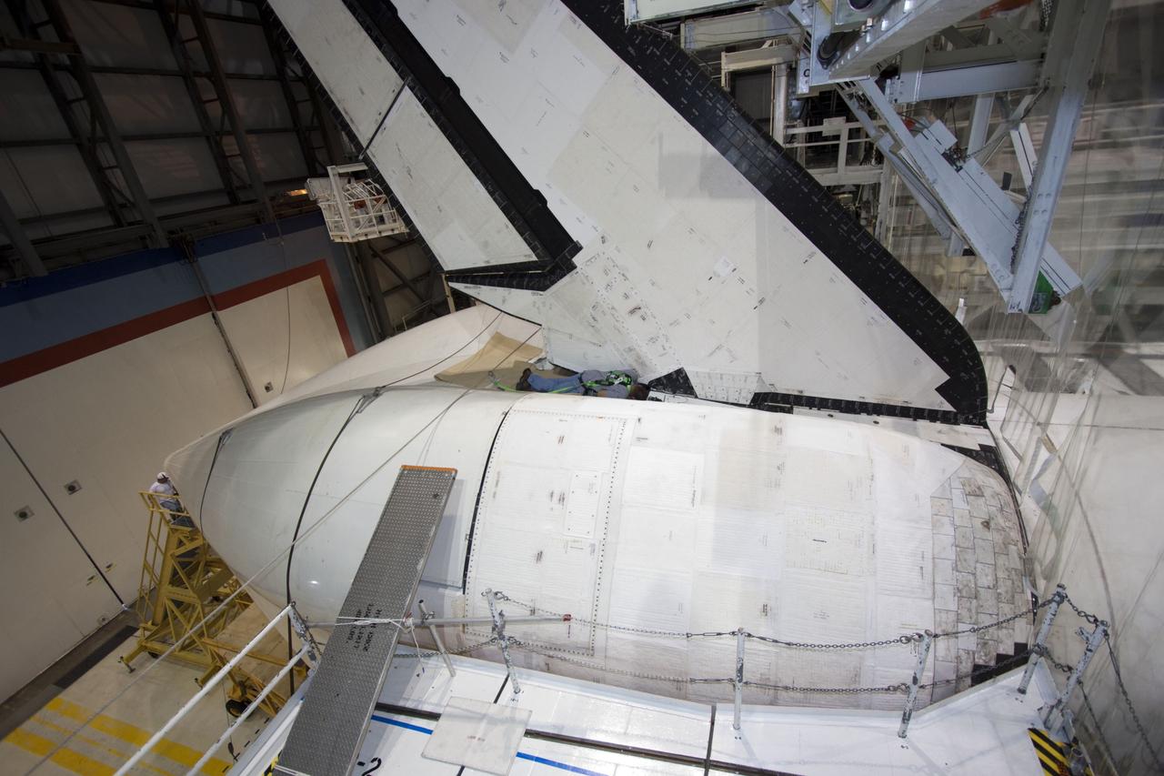 CAPE CANAVERAL, Fla. – In Orbiter Processing Facility Bay 2 at NASA’s Kennedy Space Center in Florida, the tail cone has been placed in position surrounding the replica main engines on the space shuttle Endeavour. The tail cone covers the main engines in the aft providing aerodynamic stability during the cross-country ferry flight.      The work is part of Transition and Retirement of the remaining space shuttles, Endeavour and Atlantis. Endeavour is being prepared for public display at the California Science Center in Los Angeles. Its ferry flight to California is targeted for mid-September. Endeavour was the last space shuttle added to NASA’s orbiter fleet. Over the course of its 19-year career, Endeavour spent 299 days in space during 25 missions. For more information, visit http://www.nasa.gov/transition Photo credit: NASA/ Jim Grossmann