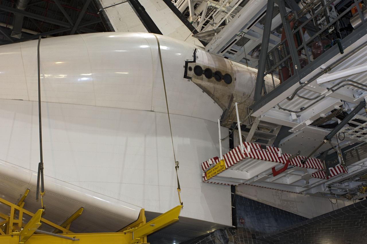 CAPE CANAVERAL, Fla. – In Orbiter Processing Facility Bay 2 at NASA’s Kennedy Space Center in Florida, the tail cone has been placed in position surrounding the replica main engines on the space shuttle Endeavour. The tail cone covers the main engines in the aft providing aerodynamic stability during the cross-country ferry flight.      The work is part of Transition and Retirement of the remaining space shuttles, Endeavour and Atlantis. Endeavour is being prepared for public display at the California Science Center in Los Angeles. Its ferry flight to California is targeted for mid-September. Endeavour was the last space shuttle added to NASA’s orbiter fleet. Over the course of its 19-year career, Endeavour spent 299 days in space during 25 missions. For more information, visit http://www.nasa.gov/transition Photo credit: NASA/ Jim Grossmann